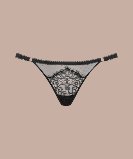 Maison Close/Scandale โ Inspiration Divine Thong Black Inspiration Divine black Thong with sheer dotted mesh, floral lace and narrow side straps, front view on model.