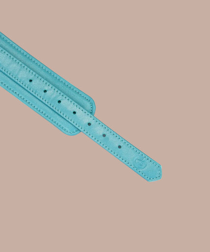 Liebe Seele Siren's Cove Lamb Leather Wrist Cuffs with Velvet Lining – Blue Pair of Liebe Seele Siren's Cove turquoise wrist cuffs connected by a gold-tone chain.