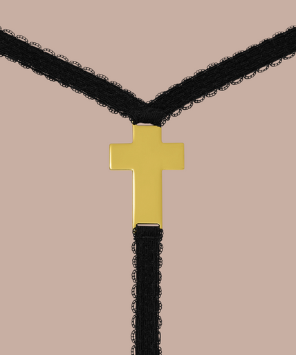 Maison Close/Scandale โ Inspiration Divine Cross Micro Thong Black Inspiration Divine black Cross Micro Thong with a sheer floral lace front and narrow side straps, front view on model.
