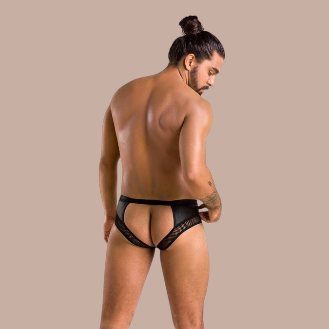 Pleasurements Passion 030 Open Slip Tom in zwart met open achterzijde en mesh details gedragen door een man