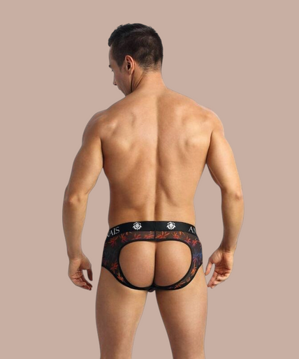 Anais Men – Chill Jock Bikini S Pleasurements Anais Men Chill Jock Bikini met palmboomprint en zwarte tailleband gedragen door een lachend model