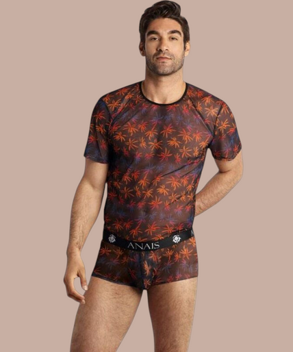 Anais Men – Chill T-Shirt M Pleasurements Anais Men Chill T-shirt met transparante stof en kleurrijk palmbladpatroon gedragen door een model