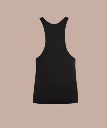 Anais Men – Petrol Top | Premium Men’s Underwear Pleasurements Anais Men Petrol top in zwart gedragen door een glimlachend model als onderdeel van premium ondermode.