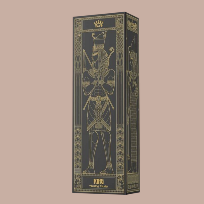 Pleasurements Zalo King Thruster in een zwarte doos met gouden Egyptische farao illustratie en luxe verpakking