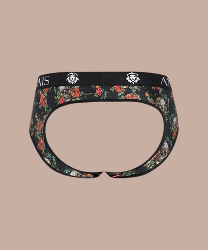 Anais Men – Power Jock Bikini | Premium Men’s Underwear Pleasurements Anais Men Power Jock Bikini met bloemenprint en zwarte tailleband gedragen door een gespierd model