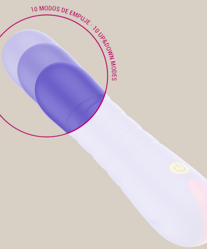 Pleasurements – Intensiv – Stella Stoßvibrator Pleasurements Stella paarse siliconen vibrator met stuwende functie vastgehouden in een hand
