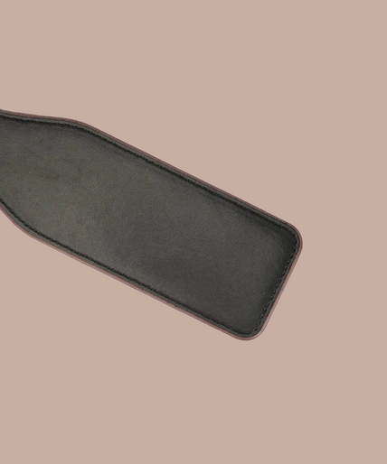 Liebe Seele wine-red rectangular spanking paddle with stitched edges and a wrist loop.