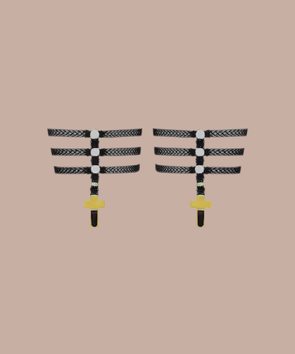 Inspiration Divine black Cross Garters with gold-tone cross drops, front view on model.