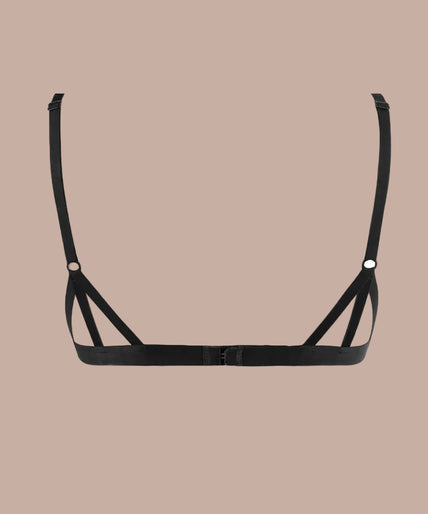 Model wearing black geometric lace triangle bra and matching string, front view.