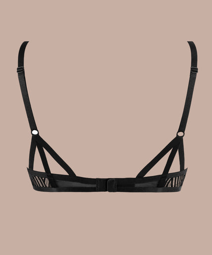 Model wearing black geometric lace underwired bra and matching tanga, front view.