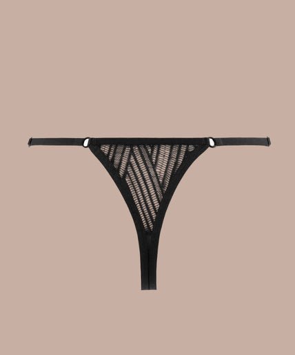 Model wearing black geometric lace string and matching underwired bra, front view with hand on hip.