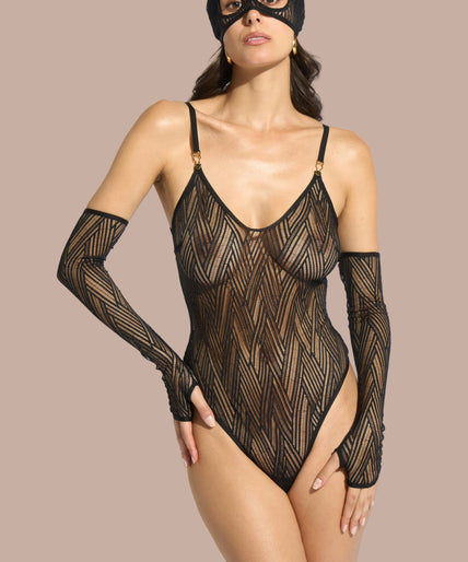 Model wearing long black lace fingerless gloves with matching bra, string and cat-ear mask, one arm raised.