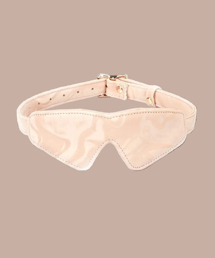 Front view of Liebe Seele Boudoir Amor blush pink blindfold with buckle strap and shaped nose cut-out.