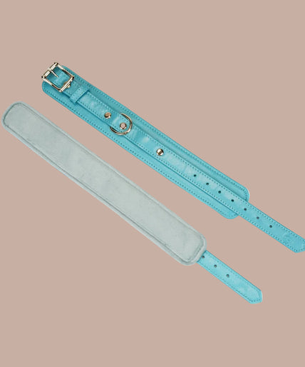 Pair of Liebe Seele Siren's Cove turquoise wrist cuffs connected by a gold-tone chain.