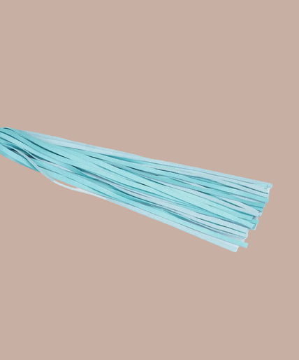 Liebe Seele Siren's Cove turquoise flogger with narrow tails, gold-tone rivets and wrist loop.