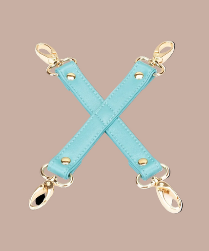 Liebe Seele Siren's Cove turquoise X-shaped connector with four gold-tone swivel clips.