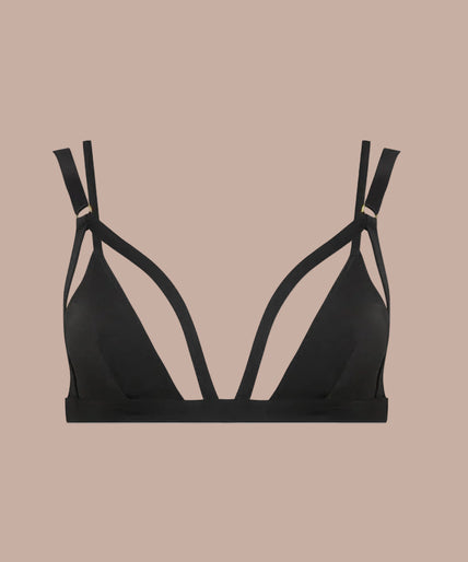 Model wearing black Fatale triangle bra with cutout straps and matching strappy bottoms, front view.