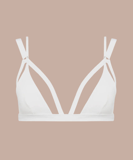 Front view of model wearing white Fatale triangle bra with cutout straps and matching white bottoms.