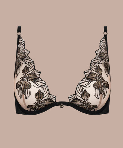 Model wearing the Atelier Amour Fleur Défendue black sheer wired triangle Bra with floral embroidery.