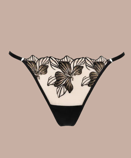 Model wearing the Atelier Amour Fleur Défendue black embroidered thong with a matching half cup Bra.