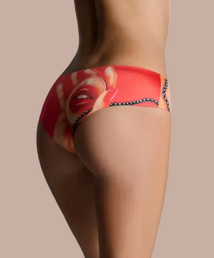 Front detail of cherry-red Comic Strip hipster briefs with lips print and dark bead trim on a model.