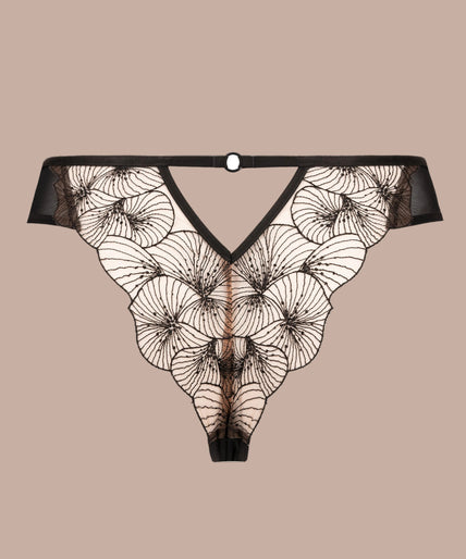Model wearing black Menu Plaisir tanga with sheer floral waistband and matching triangle bra, front view.