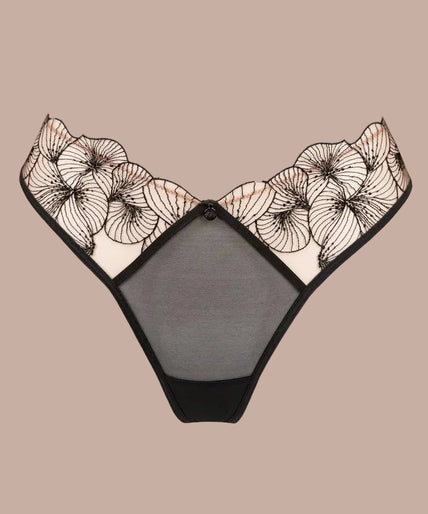 Model wearing black Menu Plaisir tanga with sheer floral waistband and matching triangle bra, front view.