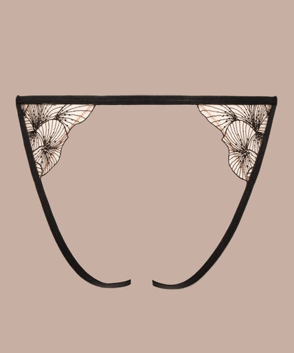 Model wearing black Menu Plaisir briefs with embroidered flowers and open waist detail, with matching bra.