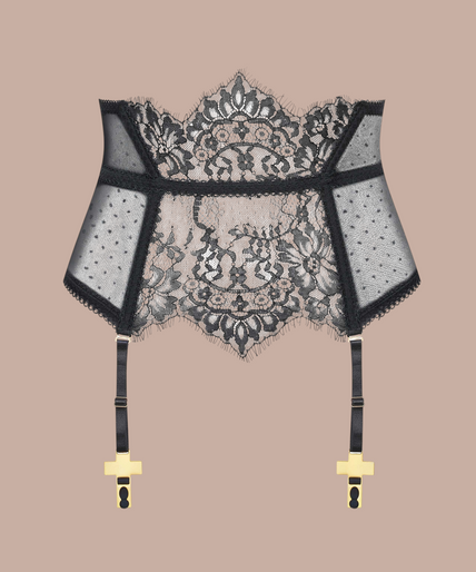 Inspiration Divine black Cross Garter Belt Corset with floral lace, mesh and gold-tone cross clips, front view on model with stockings.