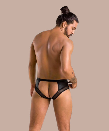 Pleasurements Passion 030 Open Slip Tom in zwart met mesh details en kettingdetail gedragen door een man.